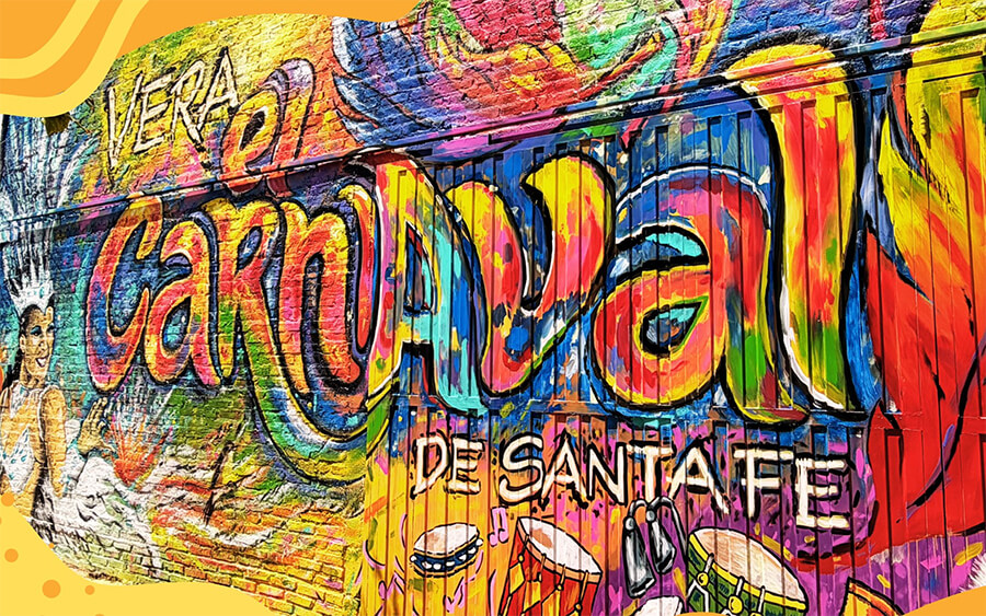 Mural artístico del carnaval de Vera realizado por el artista Lisandro Urteaga con comparsas y colores tradicionales